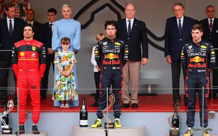 MONTE-CARLO, MONACO - MAY 29: Race winner Sergio Perez of Mexico and Oracle Red Bull Racing, Second placed Carlos Sainz of Spain and Ferrari and Third placed Max Verstappen of the Netherlands and Oracle Red Bull Racing stand on the podium during the F1 Grand Prix of Monaco at Circuit de Monaco on May 29, 2022 in Monte-Carlo, Monaco. (Photo by Eric Alonso/Getty Images)
