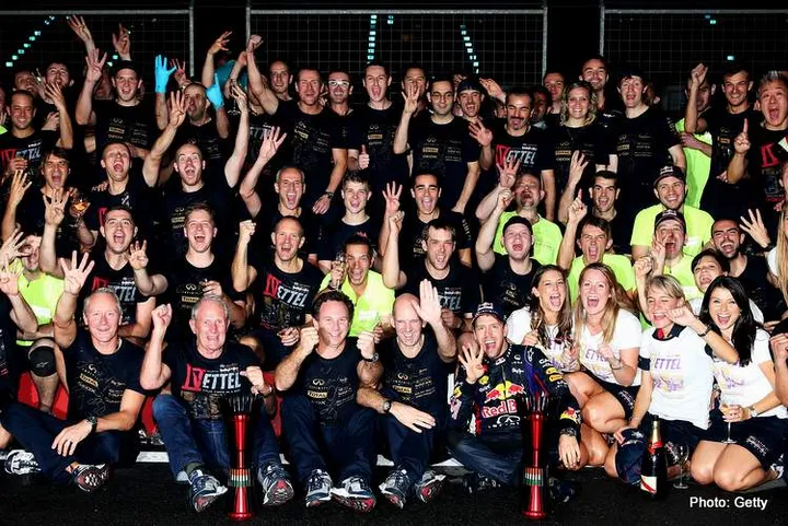 NOIDA, INDIA - OCTOBER 27:  Race winner and 2013 Formula One World Champion Sebastian Vettel of Germany and Infiniti Red Bull Racing celebrates with team mates following the Indian Formula One Grand Prix at Buddh International Circuit on October 27, 2013 in Noida, India.  (Photo by Mark Thompson/Getty Images) *** Local Caption *** Sebastian Vettel