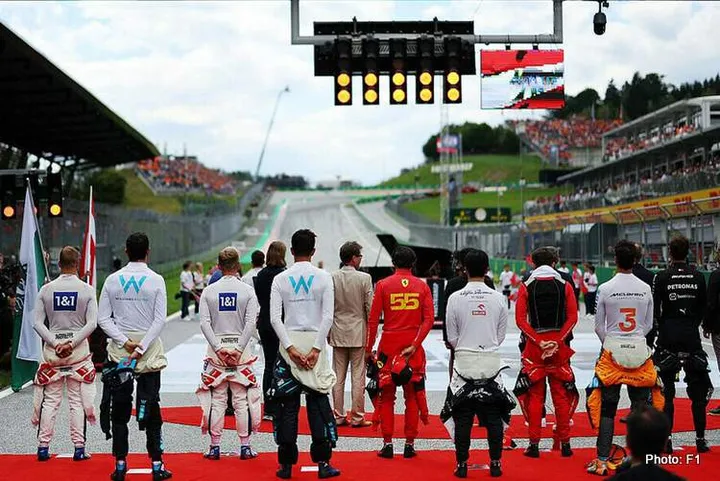 formula 1 drivers line up national anthem fia