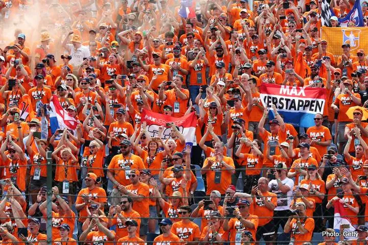 BUDAPEST, HUNGARY - AUGUST 01: Max Verstappen of Netherlands and Red Bull Racing fans show their support before the F1 Grand Prix of Hungary at Hungaroring on August 01, 2021 in Budapest, Hungary. (Photo by Peter Fox/Getty Images)