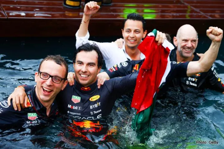 MONTE-CARLO, MONACO - MAY 29: Race winner Sergio Perez of Mexico and Oracle Red Bull Racing celebrates with his team by jumping in the pool after the F1 Grand Prix of Monaco at Circuit de Monaco on May 29, 2022 in Monte-Carlo, Monaco. (Photo by Mark Thompson/Getty Images)