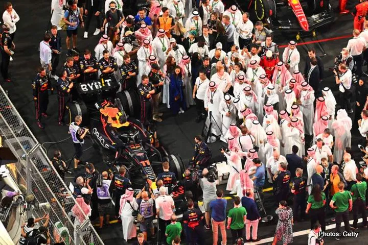 JEDDAH, SAUDI ARABIA - MARCH 27: A general view over the grid preparations showing Pole position qualifier Sergio Perez of Mexico and Oracle Red Bull Racing preparing to start the race during the F1 Grand Prix of Saudi Arabia at the Jeddah Corniche Circuit on March 27, 2022 in Jeddah, Saudi Arabia. (Photo by Clive Mason/Getty Images)