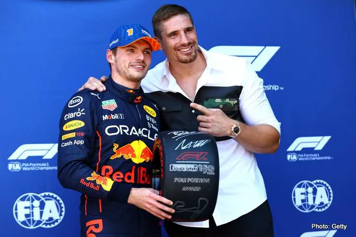 ZANDVOORT, NETHERLANDS - SEPTEMBER 03: Pole position qualifier Max Verstappen of the Netherlands and Oracle Red Bull Racing is presented with the Pirelli Pole Position Award by Rico Verhoeven in parc ferme during qualifying ahead of the F1 Grand Prix of The Netherlands at Circuit Zandvoort on September 03, 2022 in Zandvoort, Netherlands. (Photo by Mark Thompson/Getty Images)