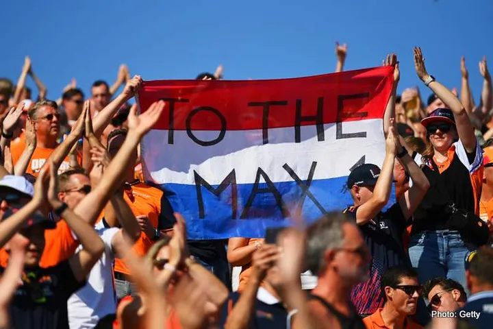 ZANDVOORT, NETHERLANDS - SEPTEMBER 03: Max Verstappen of the Netherlands and Oracle Red Bull Racing fans enjoy the atmosphere during qualifying ahead of the F1 Grand Prix of The Netherlands at Circuit Zandvoort on September 03, 2022 in Zandvoort, Netherlands. (Photo by Dan Mullan/Getty Images)