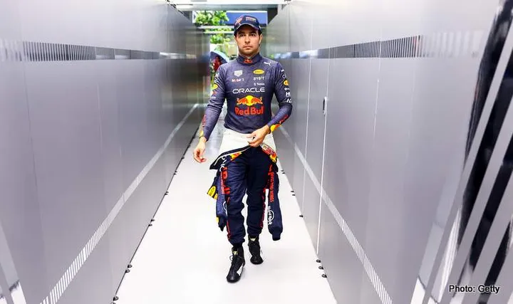 SINGAPORE, SINGAPORE - OCTOBER 01: Sergio Perez of Mexico and Oracle Red Bull Racing looks on in the garage during final practice ahead of the F1 Grand Prix of Singapore at Marina Bay Street Circuit on October 01, 2022 in Singapore, Singapore. (Photo by Mark Thompson/Getty Images,) verstappen preview