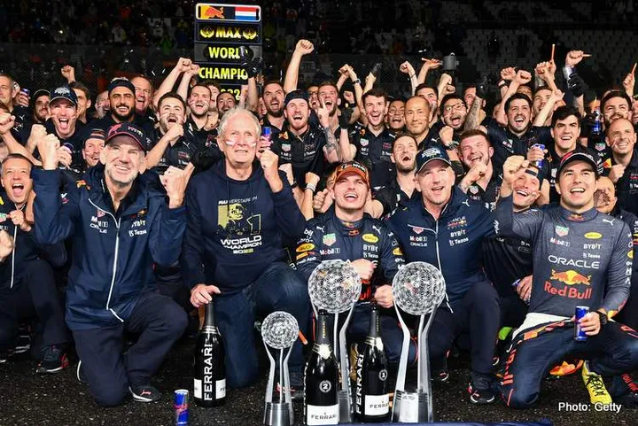 SUZUKA, JAPAN - OCTOBER 09: Race winner and 2022 F1 World Drivers Champion Max Verstappen of Netherlands and Oracle Red Bull Racing celebrates with his team after the F1 Grand Prix of Japan at Suzuka International Racing Course on October 09, 2022 in Suzuka, Japan. (Photo by Clive Mason/Getty Images)