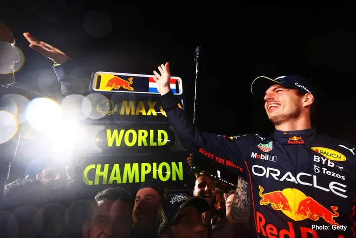 SUZUKA, JAPAN - OCTOBER 09: Race winner and 2022 F1 World Drivers Champion Max Verstappen of Netherlands and Oracle Red Bull Racing celebrates with his team after the F1 Grand Prix of Japan at Suzuka International Racing Course on October 09, 2022 in Suzuka, Japan. (Photo by Mark Thompson/Getty Images )