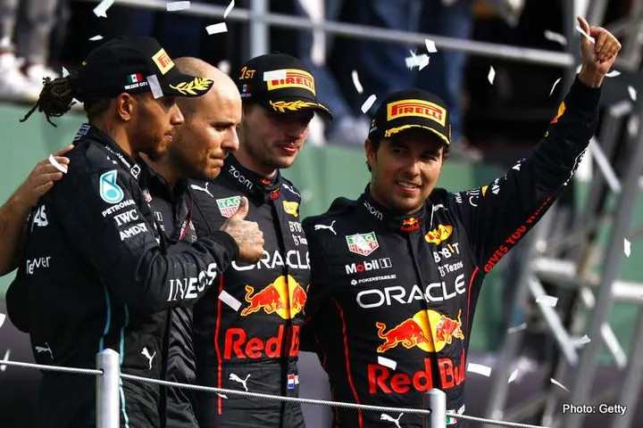 MEXICO CITY, MEXICO - OCTOBER 30: Race winner Max Verstappen of the Netherlands and Oracle Red Bull Racing, Second placed Lewis Hamilton of Great Britain and Mercedes, Third placed Sergio Perez of Mexico and Oracle Red Bull Racing and Red Bull Racing race engineer Gianpiero Lambiase celebrate on the podium during the F1 Grand Prix of Mexico at Autodromo Hermanos Rodriguez on October 30, 2022 in Mexico City, Mexico. (Photo by Chris Graythen/Getty Images)