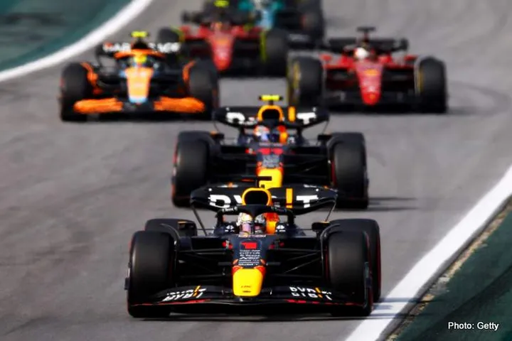 SAO PAULO, BRAZIL - NOVEMBER 13: Max Verstappen of the Netherlands driving the (1) Oracle Red Bull Racing RB18 leads a line of cars during the F1 Grand Prix of Brazil at Autodromo Jose Carlos Pace on November 13, 2022 in Sao Paulo, Brazil. (Photo by Jared C. Tilton/Getty Images)