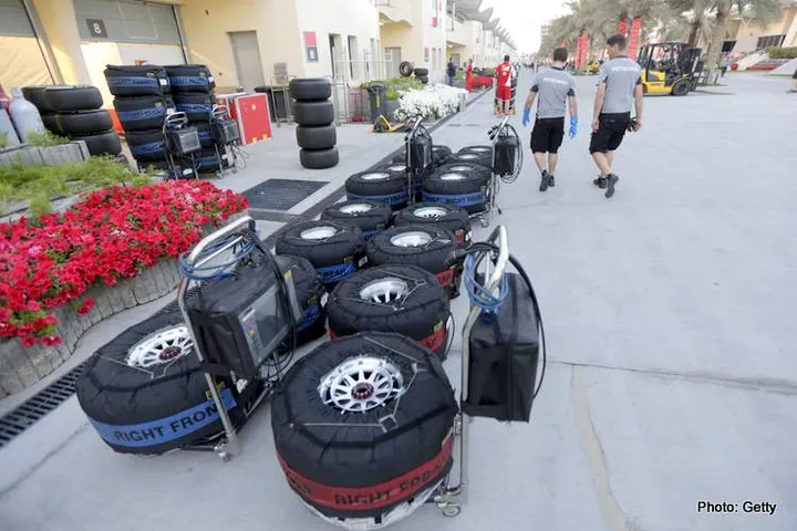 Tyres in blankets are lined up in the paddock