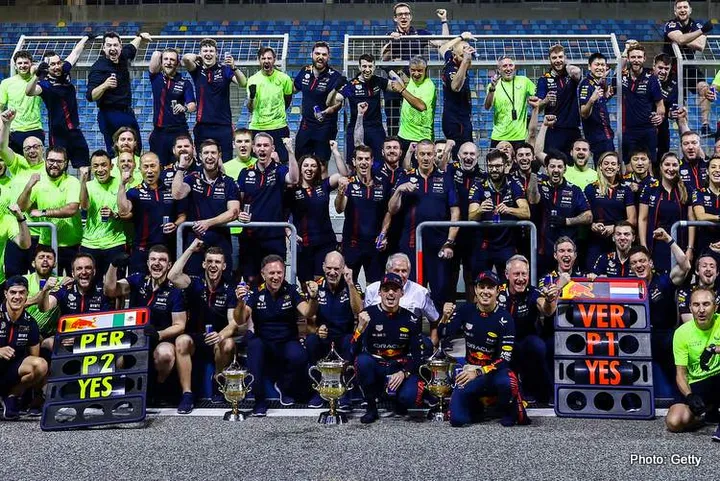 BAHRAIN, BAHRAIN - MARCH 05: Race winner Max Verstappen of the Netherlands and Oracle Red Bull Racing and Second placed Sergio Perez of Mexico and Oracle Red Bull Racing celebrate with their team after the F1 Grand Prix of Bahrain at Bahrain International Circuit on March 05, 2023 in Bahrain, Bahrain. (Photo by Mark Thompson/Getty Images)