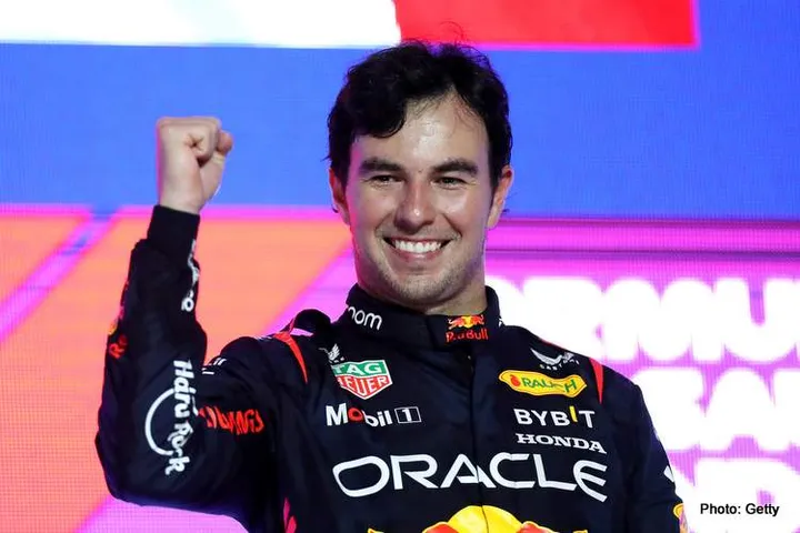 JEDDAH, SAUDI ARABIA - MARCH 19: Race winner Sergio Perez of Mexico and Oracle Red Bull Racing celebrates on the podium during the F1 Grand Prix of Saudi Arabia at Jeddah Corniche Circuit on March 19, 2023 in Jeddah, Saudi Arabia. (Photo by Peter Fox/Getty Images)