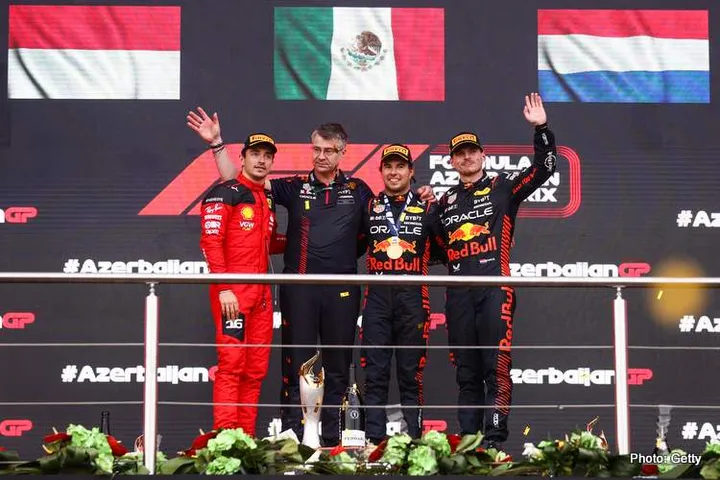 BAKU, AZERBAIJAN - APRIL 30: Race winner Sergio Perez of Mexico and Oracle Red Bull Racing, Third placed Charles Leclerc of Monaco and Ferrari, Second placed Max Verstappen of the Netherlands and Oracle Red Bull Racing and Paul Everington, Head of Electronics at Red Bull Racing celebrate on the podium during the F1 Grand Prix of Azerbaijan at Baku City Circuit on April 30, 2023 in Baku, Azerbaijan. (Photo by Alex Pantling/Getty Images)