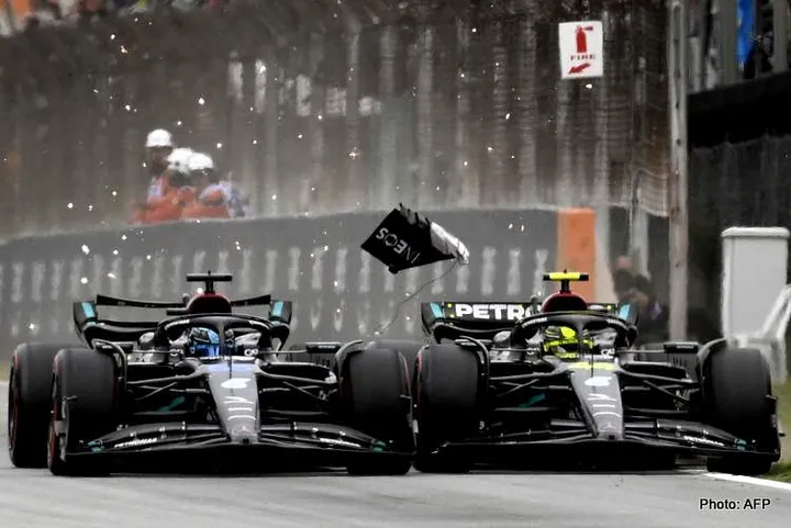 Mercedes' British driver George Russell (L) and Mercedes' British driver Lewis Hamilton compete during the qualifying session for the Spanish Formula One Grand Prix at the Circuit de Catalunya on June 3, 2023 in Montmelo, on the outskirts of Barcelona. (Photo by Josep LAGO / AFP)