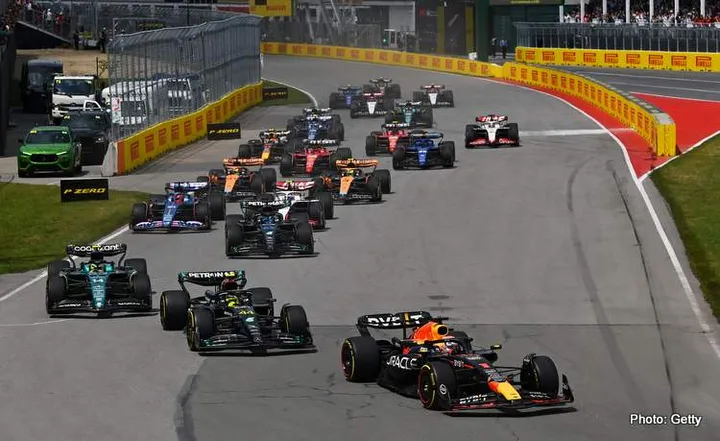 MONTREAL, QUEBEC - JUNE 18: Max Verstappen of the Netherlands driving the (1) Oracle Red Bull Racing RB19 leads Lewis Hamilton of Great Britain driving the (44) Mercedes AMG Petronas F1 Team W14 and the rest of the field at the start during the F1 Grand Prix of Canada at Circuit Gilles Villeneuve on June 18, 2023 in Montreal, Quebec. (Wolff by Dan Mullan/Getty Images)