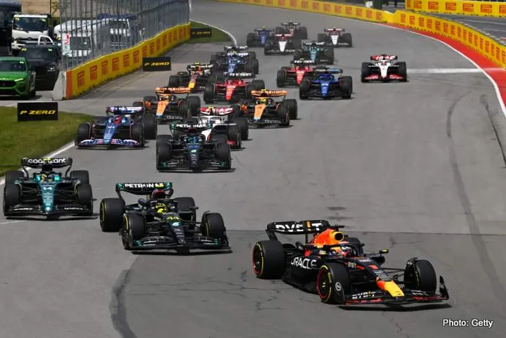 MONTREAL, QUEBEC - JUNE 18: Max Verstappen of the Netherlands driving the (1) Oracle Red Bull Racing RB19 leads Lewis Hamilton of Great Britain driving the (44) Mercedes AMG Petronas F1 Team W14 and the rest of the field at the start during the F1 Grand Prix of Canada at Circuit Gilles Villeneuve on June 18, 2023 in Montreal, Quebec. (Photo by Dan Mullan/Getty Images)