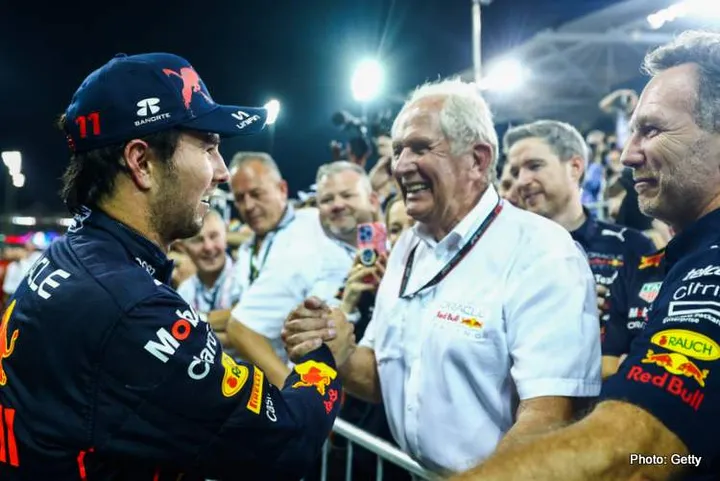 ABU DHABI, UNITED ARAB EMIRATES - NOVEMBER 20: Third placed Sergio Perez of Mexico and Oracle Red Bull Racing celebrates with Red Bull Racing Team Consultant Dr Helmut Marko and Red Bull Racing Team Principal Christian Horner in parc ferme during the F1 Grand Prix of Abu Dhabi at Yas Marina Circuit on November 20, 2022 in Abu Dhabi, United Arab Emirates. (Photo by Mark Thompson/Getty Images)