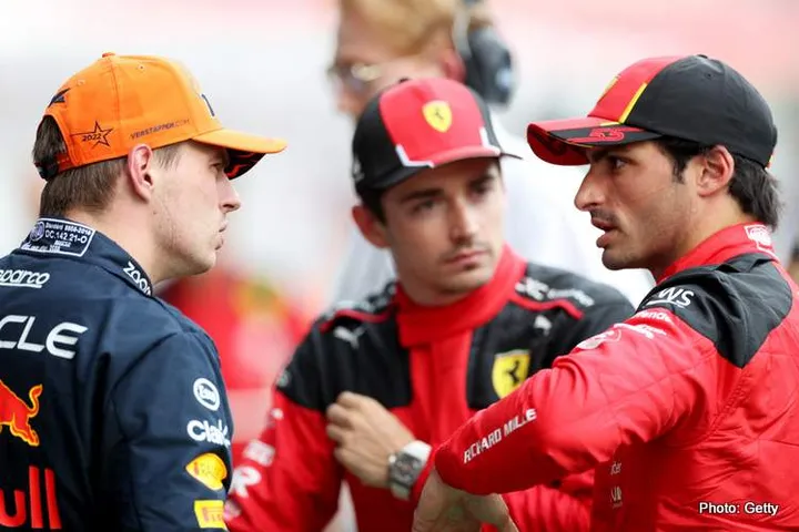 SPIELBERG, AUSTRIA - JUNE 30: Pole position qualifier Max Verstappen of the Netherlands and Oracle Red Bull Racing and Third placed qualifier Carlos Sainz of Spain and Ferrari talk in parc ferme during qualifying ahead of the F1 Grand Prix of Austria at Red Bull Ring on June 30, 2023 in Spielberg, Austria. (Photo by Peter Fox/Getty Images)