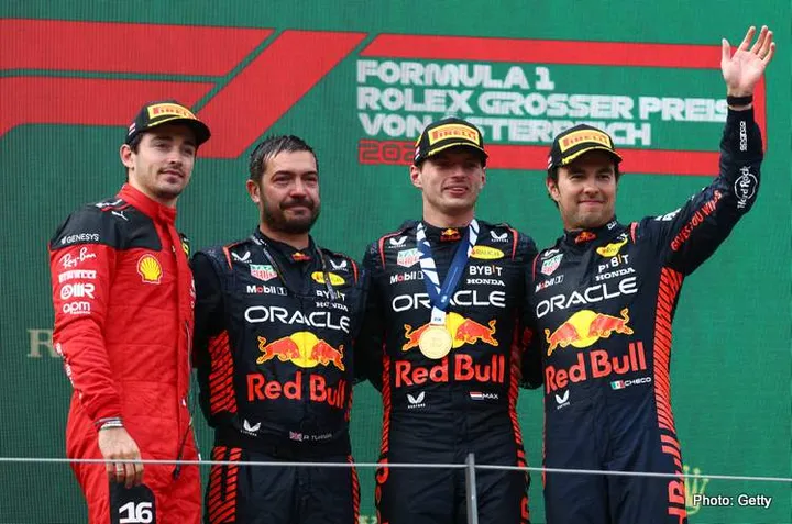 SPIELBERG, AUSTRIA - JULY 02: Race winner Max Verstappen of the Netherlands and Oracle Red Bull Racing (second from right), Second placed Charles Leclerc of Monaco and Ferrari (L), Third placed Sergio Perez of Mexico and Oracle Red Bull Racing (R) and Phil Turner of Red Bull Racing (second from left) celebrate on the podium during the F1 Grand Prix of Austria at Red Bull Ring on July 02, 2023 in Spielberg, Austria. (Photo by Clive Rose/Getty Images)