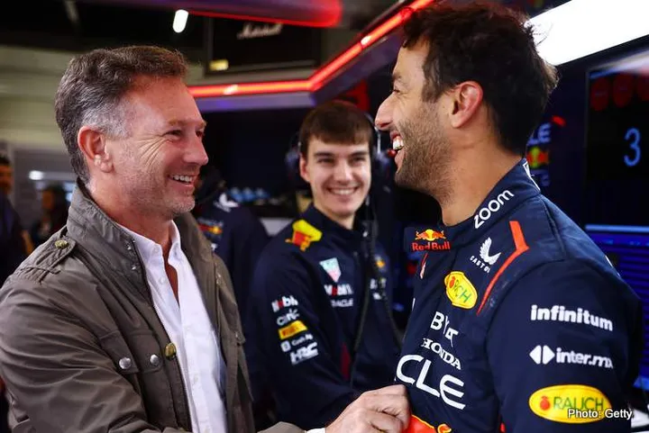 NORTHAMPTON, ENGLAND - JULY 11: Daniel Ricciardo of Australia and Oracle Red Bull Racing speaks with Red Bull Racing Team Principal Christian Horner as he prepares to drive during Formula 1 testing at Silverstone Circuit on July 11, 2023 in Northampton, England. (Photo by Mark Thompson/Getty Images)