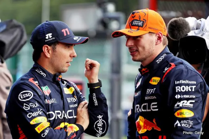 SPA, BELGIUM - JULY 28: Pole position qualifier Max Verstappen of the Netherlands and Oracle Red Bull Racing and Third placed qualifier Sergio Perez of Mexico and Oracle Red Bull Racing talk in parc ferme during qualifying ahead of the F1 Grand Prix of Belgium at Circuit de Spa-Francorchamps on July 28, 2023 in Spa, Belgium. (Photo by Peter Fox/Getty Images)