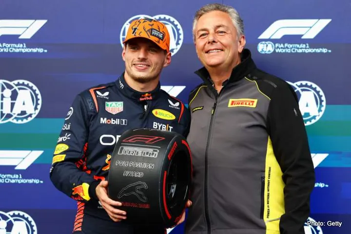 SPA, BELGIUM - JULY 28: Pole position qualifier Max Verstappen of the Netherlands and Oracle Red Bull Racing is presented with the Pirelli Pole Position trophy by Director of Pirelli F1 Mario Isola during qualifying ahead of the F1 Grand Prix of Belgium at Circuit de Spa-Francorchamps on July 28, 2023 in Spa, Belgium. (Photo by Mark Thompson/Getty Images)