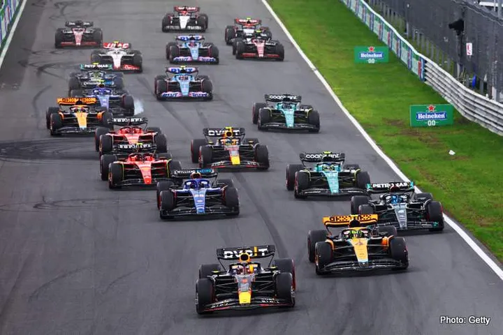 ZANDVOORT, NETHERLANDS - AUGUST 27: Max Verstappen of the Netherlands driving the (1) Oracle Red Bull Racing RB19 leads Lando Norris of Great Britain driving the (4) McLaren MCL60 Mercedes, George Russell of Great Britain driving the (63) Mercedes AMG Petronas F1 Team W14 and the rest of the field into turn one at the start during the F1 Grand Prix of The Netherlands at Circuit Zandvoort on August 27, 2023 in Zandvoort, Netherlands. (Photo by Mark Thompson/Getty Images) // Getty Images / Red Bull Content Pool // SI202308270586 // Usage for editorial use only //