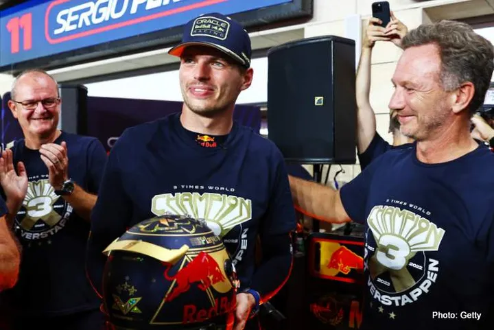 LUSAIL CITY, QATAR - OCTOBER 07: 2023 F1 World Drivers Champion Max Verstappen of the Netherlands and Oracle Red Bull Racing is congraulted by Red Bull Racing Team Principal Christian Horner as he is presented with a celebratory helmet after the Sprint ahead of the F1 Grand Prix of Qatar at Lusail International Circuit on October 07, 2023 in Lusail City, Qatar. (Photo by Mark Thompson/Getty Images) // Getty Images / Red Bull Content Pool // SI202310070623 // Usage for editorial use only //
