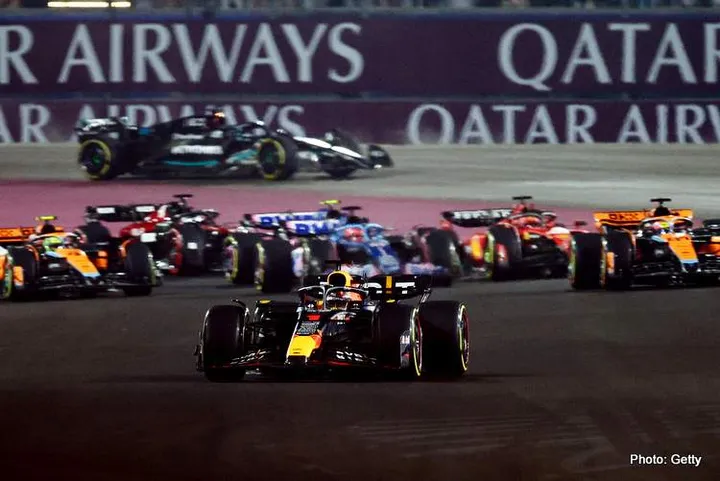 LUSAIL CITY, QATAR - OCTOBER 08: Max Verstappen of the Netherlands driving the (1) Oracle Red Bull Racing RB19 leads the field at the start during the F1 Grand Prix of Qatar at Lusail International Circuit on October 08, 2023 in Lusail City, Qatar. (Photo by Clive Rose/Getty Images) // Getty Images / Red Bull Content Pool // SI202310080419 // Usage for editorial use only //