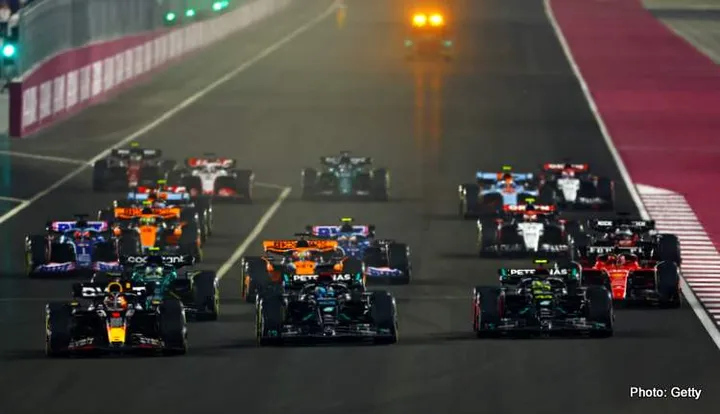LUSAIL CITY, QATAR - OCTOBER 08: Max Verstappen of the Netherlands driving the (1) Oracle Red Bull Racing RB19 leads George Russell of Great Britain driving the (63) Mercedes AMG Petronas F1 Team W14, Lewis Hamilton of Great Britain driving the (44) Mercedes AMG Petronas F1 Team W14 and the rest of the field into turn one at the start during the F1 Grand Prix of Qatar at Lusail International Circuit on October 08, 2023 in Lusail City, Qatar. (Photo by Mark Thompson/Getty Images)