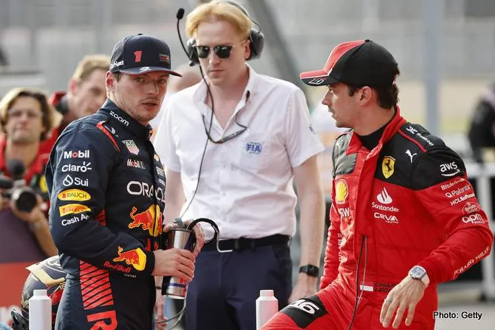 AUSTIN, TEXAS - OCTOBER 21: Sprint winner Max Verstappen of the Netherlands and Oracle Red Bull Racing and Third placed Charles Leclerc of Monaco and Ferrari talk in parc ferme during the Sprint ahead of the F1 Grand Prix of United States at Circuit of The Americas on October 21, 2023 in Austin, Texas. (Photo by Chris Graythen/Getty Images)