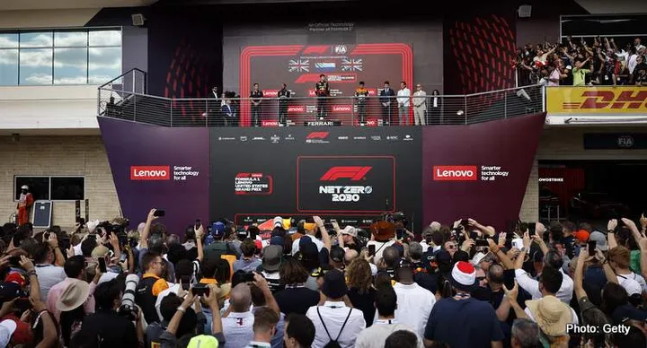 AUSTIN, TEXAS - OCTOBER 22: Race winner Max Verstappen of the Netherlands and Oracle Red Bull Racing, Second placed Lewis Hamilton of Great Britain and Mercedes, Third placed Lando Norris of Great Britain and McLaren and John Hammond of Red Bull Racing celebrate on the podium during the F1 Grand Prix of United States at Circuit of The Americas on October 22, 2023 in Austin, Texas. (Photo by Chris Graythen/Getty Images)