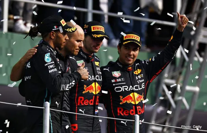 MEXICO CITY, MEXICO - OCTOBER 30: Race winner Max Verstappen of the Netherlands and Oracle Red Bull Racing, Second placed Lewis Hamilton of Great Britain and Mercedes, Third placed Sergio Perez of Mexico and Oracle Red Bull Racing and Red Bull Racing race engineer Gianpiero Lambiase celebrate on the podium during the F1 Grand Prix of Mexico at Autodromo Hermanos Rodriguez on October 30, 2022 in Mexico City, Mexico. (Photo by Chris Graythen/Getty Images)