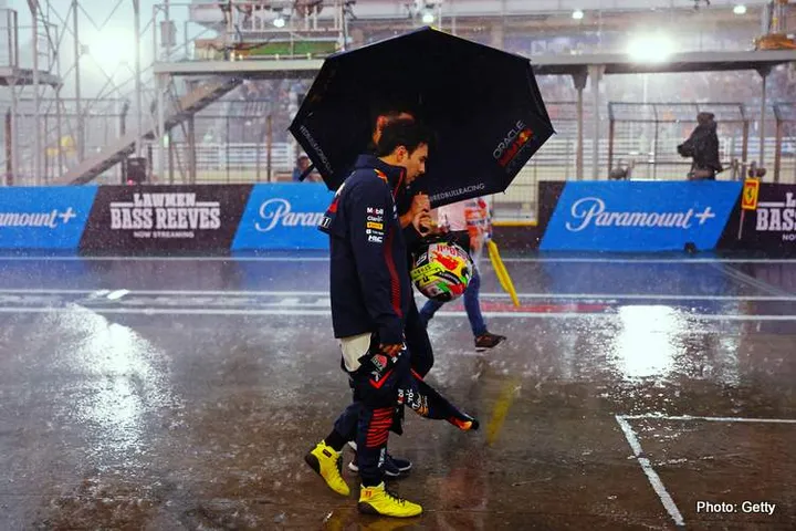SAO PAULO, BRAZIL - NOVEMBER 03: Sergio Perez of Mexico and Oracle Red Bull Racing walks in the Pitlane during qualifying ahead of the F1 Grand Prix of Brazil at Autodromo Jose Carlos Pace on November 03, 2023 in Sao Paulo, Brazil. (Photo by Mark Thompson/Getty Images)
