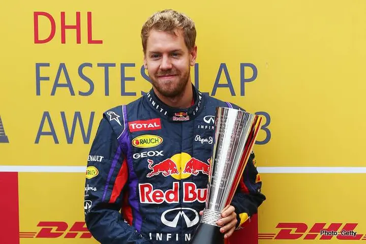 SAO PAULO, BRAZIL - NOVEMBER 24: Sebastian Vettel of Germany and Infiniti Red Bull Racing receives the DHL Fastest Lap Award for this season before the Brazilian Formula One Grand Prix at Autodromo Jose Carlos Pace on November 24, 2013 in Sao Paulo, Brazil. (Photo by Paul Gilham/Getty Images) *** Local Caption *** Sebastian Vettel