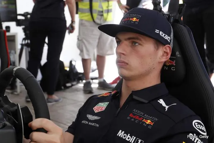 BUDAPEST, HUNGARY - MAY 01: Villeneuve: Max makes the difference, he’s at it 24 hours a day Max Verstappen of Netherlands and Red Bull Racing on a racing simulator during the Red Bull Racing Budapest Showrun on May 1, 2018 in Budapest, Hungary. (Photo by Laszlo Balogh/Getty Images for Red Bull Racing)