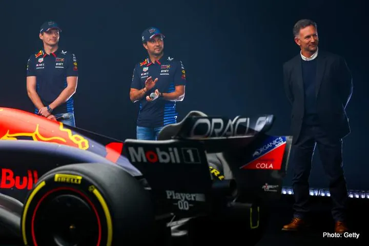 MILTON KEYNES, ENGLAND - FEBRUARY 15: Max Verstappen of the Netherlands and Oracle Red Bull Racing, Sergio Perez of Mexico and Oracle Red Bull Racing and Red Bull Racing Team Principal Christian Horner stand with the RB20 during the Oracle Red Bull Racing RB20 car launch at Red Bull Racing Factory on February 15, 2024 in Milton Keynes, England. (Photo by Mark Thompson/Getty Images for Red Bull Racing) // SI202402150752 // Usage for editorial use only //