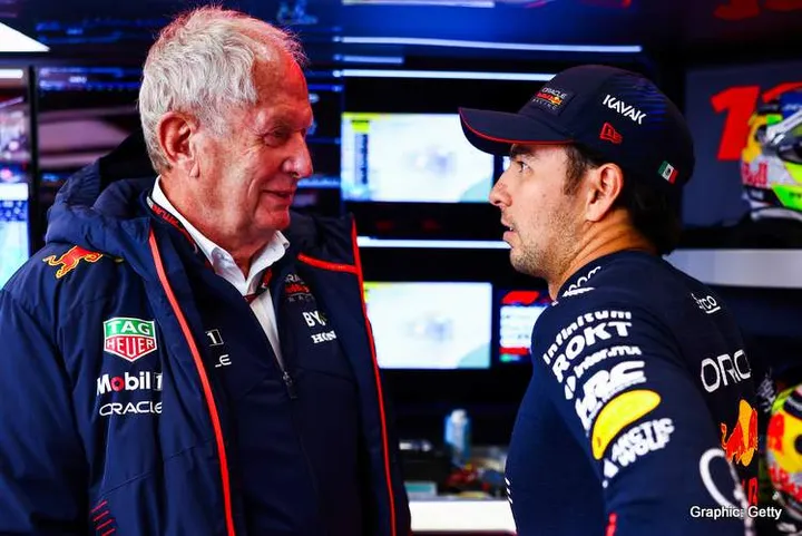 ZANDVOORT, NETHERLANDS - AUGUST 26: Sergio Perez of Mexico and Oracle Red Bull Racing talks with Red Bull Racing Team Consultant Dr Helmut Marko in the garage during qualifying ahead of the F1 Grand Prix of The Netherlands at Circuit Zandvoort on August 26, 2023 in Zandvoort, Netherlands. (Photo by Mark Thompson/Getty Images)