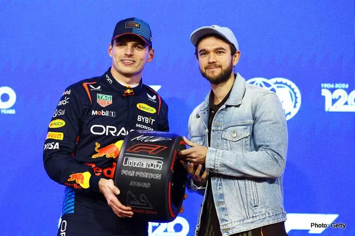 BAHRAIN, BAHRAIN - MARCH 01: Pole position qualifier Max Verstappen of the Netherlands and Oracle Red Bull Racing, is presented with the Pirelli Pole Position award by Zedd in parc ferme during qualifying ahead of the F1 Grand Prix of Bahrain at Bahrain International Circuit on March 01, 2024 in Bahrain, Bahrain. (Photo by Mark Thompson/Getty Images)