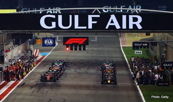 BAHRAIN, BAHRAIN - MARCH 02: Max Verstappen of the Netherlands driving the (1) Oracle Red Bull Racing RB20 and Charles Leclerc of Monaco driving the (16) Ferrari SF-24 prepare to leave the grid for the formation lap prior to the F1 Grand Prix of Bahrain at Bahrain International Circuit on March 02, 2024 in Bahrain, Bahrain. (Photo by Mark Thompson/Getty Images)