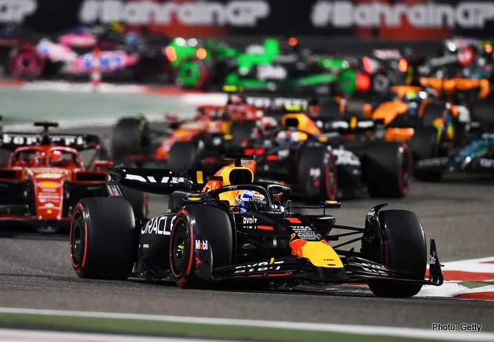 BAHRAIN, BAHRAIN - MARCH 02: Max Verstappen of the Netherlands driving the (1) Oracle Red Bull Racing RB20 leads Charles Leclerc of Monaco driving the (16) Ferrari SF-24 and the rest of the field during the F1 Grand Prix of Bahrain at Bahrain International Circuit on March 02, 2024 in Bahrain, Bahrain. (Photo by Rudy Carezzevoli/Getty Images)