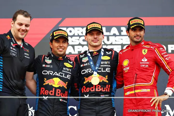 SUZUKA, JAPAN - APRIL 07: Race winner Max Verstappen of the Netherlands and Oracle Red Bull Racing, Second placed Sergio Perez of Mexico and Oracle Red Bull Racing and Third placed Carlos Sainz of Spain and Ferrari celebrate with Craig Dear, Principal Aerodynamicist at Oracle Red Bull Racing on the podium the F1 Grand Prix of Japan at Suzuka International Racing Course on April 07, 2024 in Suzuka, Japan. (Photo by Peter Fox/Getty Images)