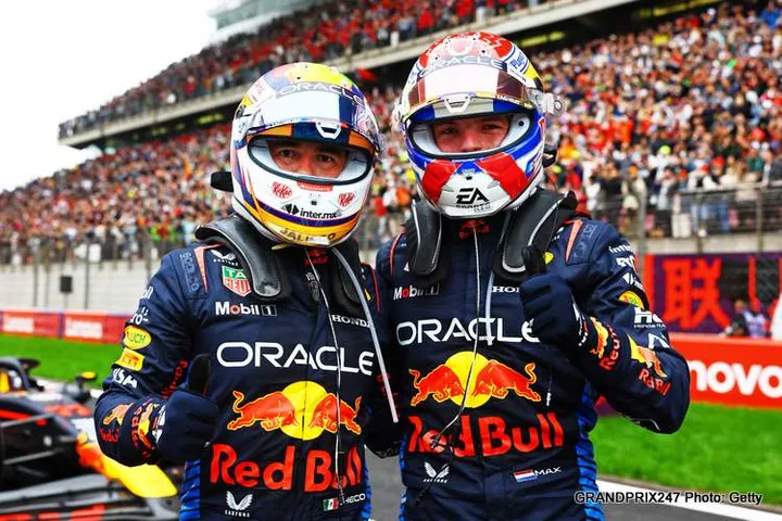 SHANGHAI, CHINA - APRIL 21: Race winner Max Verstappen of the Netherlands and Oracle Red Bull Racing and Third placed Sergio Perez of Mexico and Oracle Red Bull Racing celebrate in parc ferme after the F1 Grand Prix of China at Shanghai International Circuit on April 21, 2024 in Shanghai, China. (Photo by Mark Thompson/Getty Images)