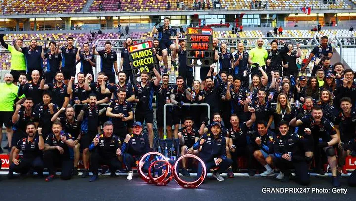 SHANGHAI, CHINA - APRIL 21: Race winner Max Verstappen of the Netherlands and Oracle Red Bull Racing and Third placed Sergio Perez of Mexico and Oracle Red Bull Racing celebrate with their team after the F1 Grand Prix of China at Shanghai International Circuit on April 21, 2024 in Shanghai, China. (Photo by Mark Thompson/Getty Images) marko