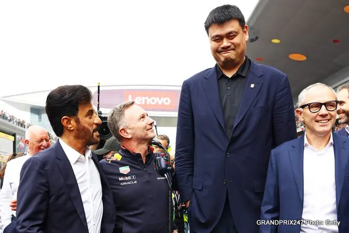SHANGHAI, CHINA - APRIL 21: Mohammed ben Sulayem, FIA President, Oracle Red Bull Racing Team Principal Christian Horner, Yao Ming and Stefano Domenicali, CEO of the Formula One Group, talk on the grid prior to the F1 Grand Prix of China at Shanghai International Circuit on April 21, 2024 in Shanghai, China. (Photo by Mark Thompson/Getty Images)