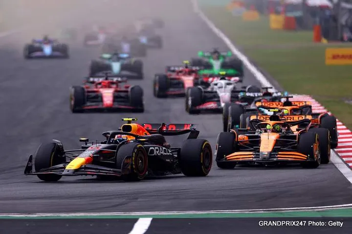 SHANGHAI, CHINA - APRIL 21: Sergio Perez of Mexico driving the (11) Oracle Red Bull Racing RB20 leads Lando Norris of Great Britain driving the (4) McLaren MCL38 Mercedes during the F1 Grand Prix of China at Shanghai International Circuit on April 21, 2024 in Shanghai, China. (Photo by Lars Baron/Getty Images)