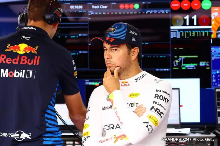 IMOLA, ITALY - MAY 18: Sergio Perez of Mexico and Oracle Red Bull Racing talks with race engineer Hugh Bird in the garage prior to qualifying ahead of the F1 Grand Prix of Emilia-Romagna at Autodromo Enzo e Dino Ferrari Circuit on May 18, 2024 in Imola, Italy. (Photo by Mark Thompson/Getty Images)