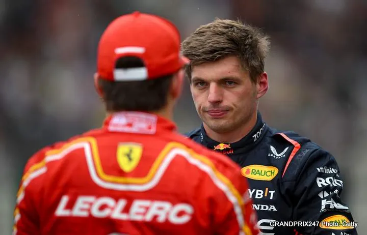 SPA, BELGIUM - JULY 27: Pole position qualifier Max Verstappen of the Netherlands and Oracle Red Bull Racing talks with Second placed qualifier Charles Leclerc of Monaco and Ferrari in parc ferme during qualifying ahead of the F1 Grand Prix of Belgium at Circuit de Spa-Francorchamps on July 27, 2024 in Spa, Belgium. (Photo by Rudy Carezzevoli/Getty Images)
