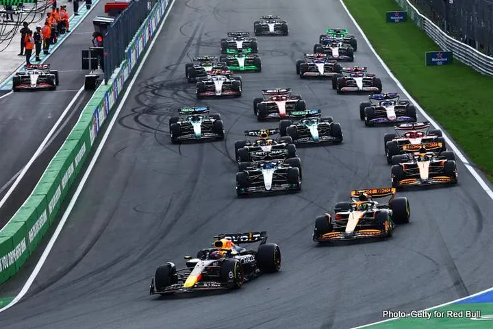 ZANDVOORT, NETHERLANDS - AUGUST 25: Max Verstappen of the Netherlands driving the (1) Oracle Red Bull Racing RB20 leads Lando Norris of Great Britain driving the (4) McLaren MCL38 Mercedes during the F1 Grand Prix of Netherlands at Circuit Zandvoort on August 25, 2024 in Zandvoort, Netherlands. (Photo by Mark Thompson/Getty Images)