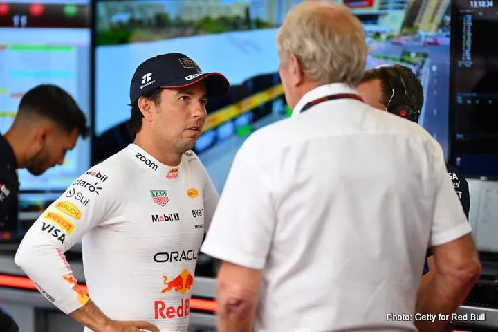 BAKU, AZERBAIJAN - SEPTEMBER 13: Sergio Perez of Mexico and Oracle Red Bull Racing talks with Oracle Red Bull Racing Team Consultant Dr Helmut Marko in the garage during practice ahead of the F1 Grand Prix of Azerbaijan at Baku City Circuit on September 13, 2024 in Baku, Azerbaijan. (Photo by Dan Mullan/Getty Images)